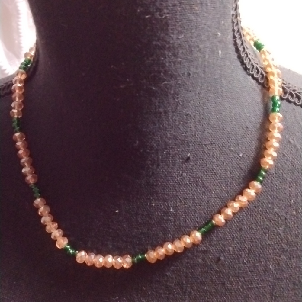 Hand crafted single strand glass bead necklace.